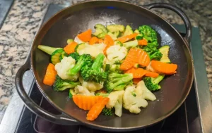 Stir-Fried Broccoli with Carrots in a Skillet